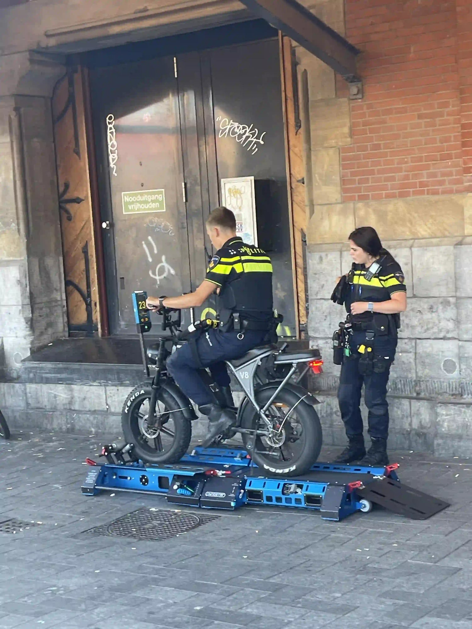Amsterdam, Netherlands: police using a portable rolling rig to check whether an e-bike’s speed limiter has been removed