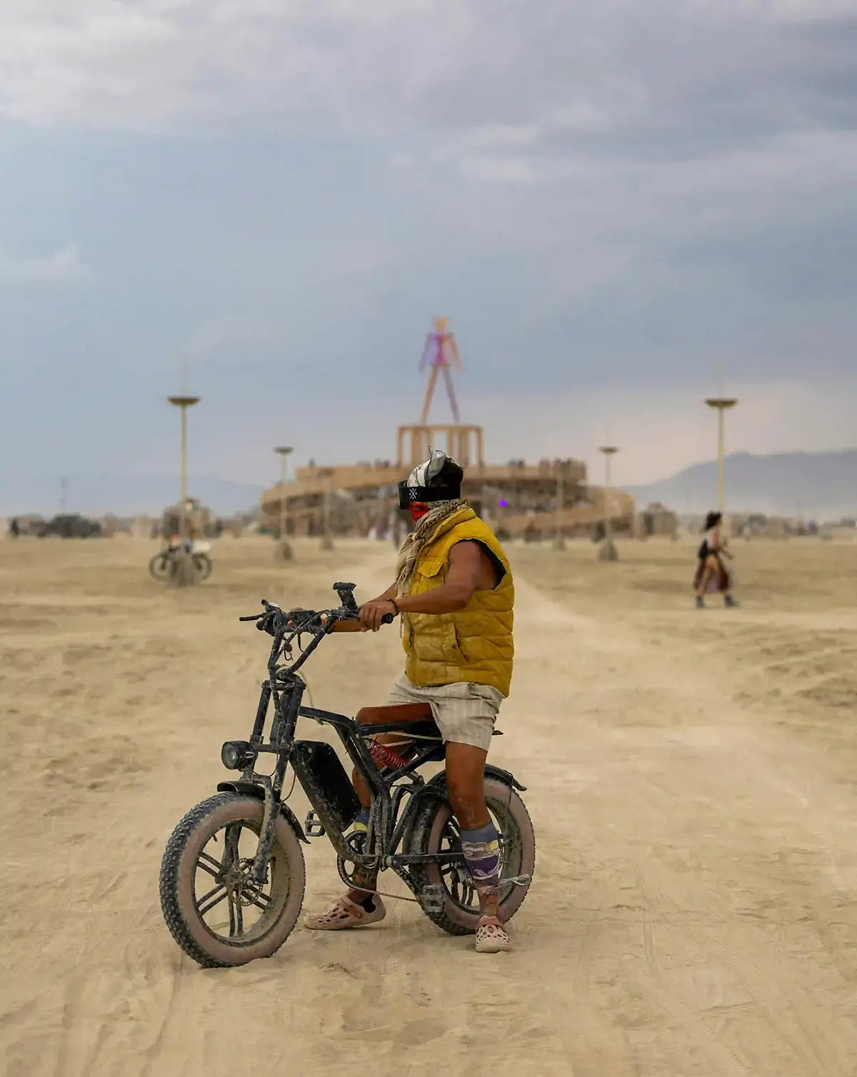Man riding a fat-tire eBike on dusty desert ground